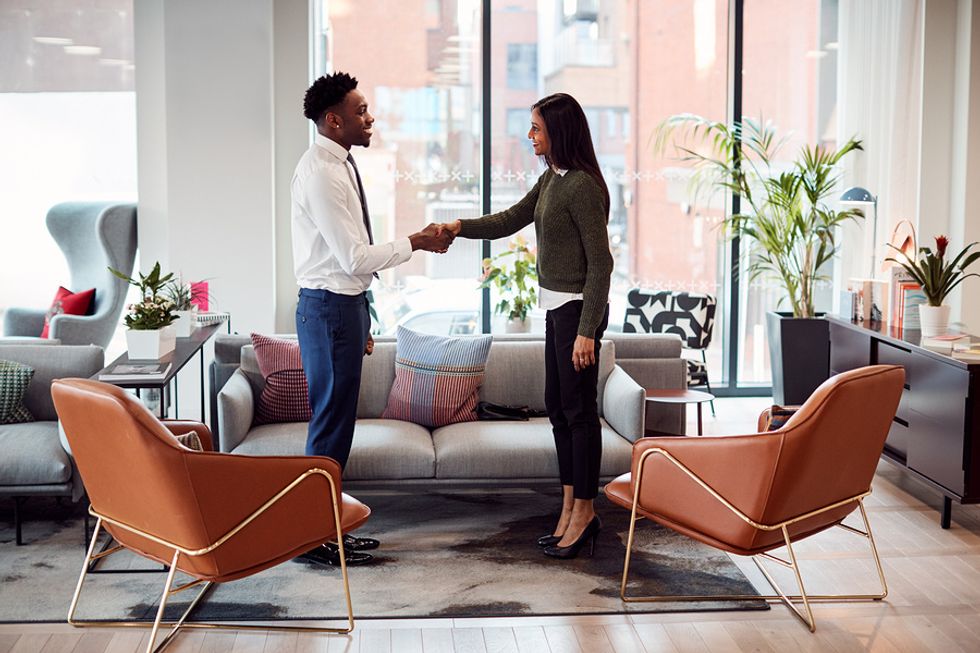 Man shakes the hiring manager's hand before a job interview