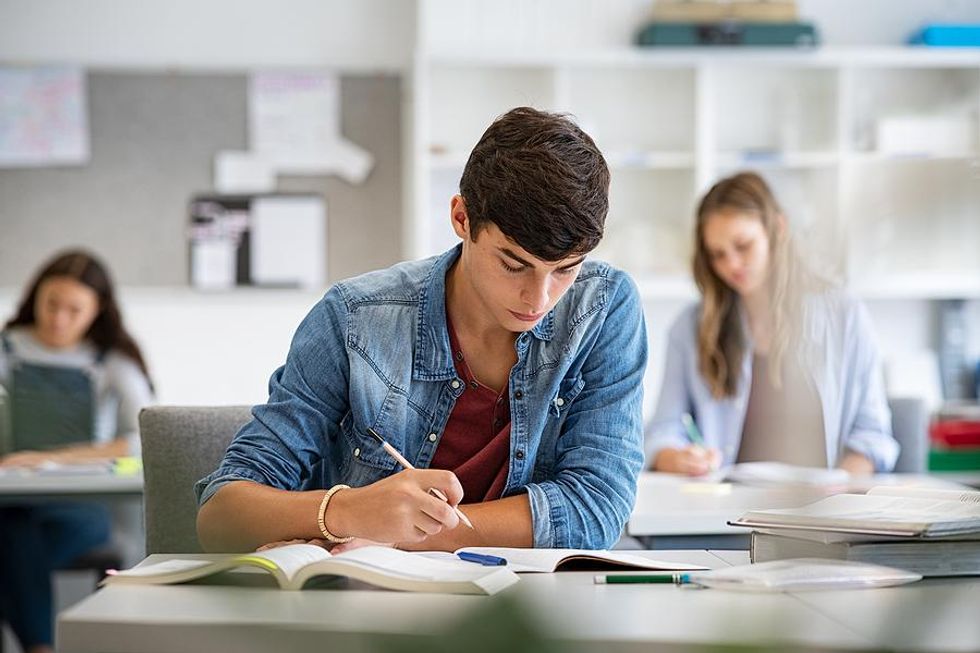 Student takes notes during class