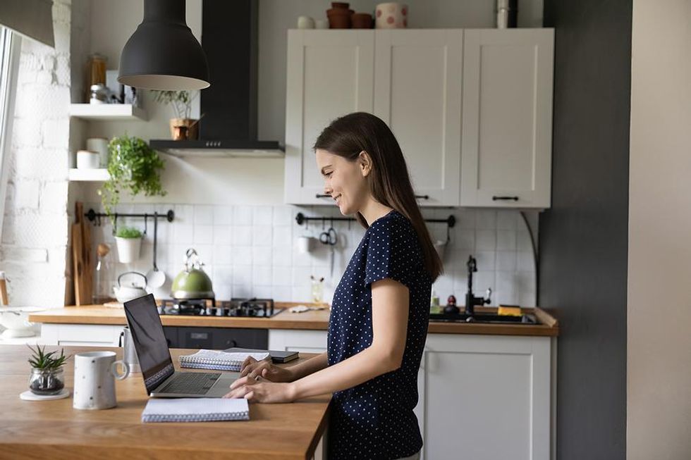 Woman on laptop updating her LinkedIn profile