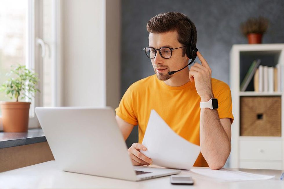 Man on the phone works from home