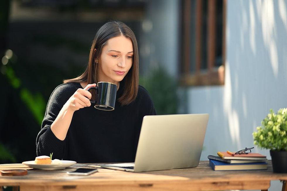 Woman on laptop uses a new technology for work