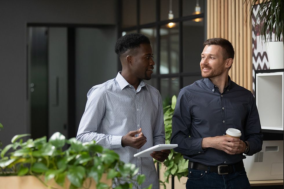 Man networks with a colleague at work