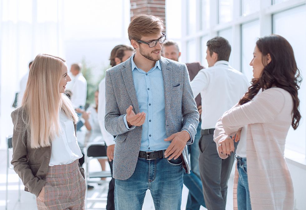 Man starts a conversation at a networking event