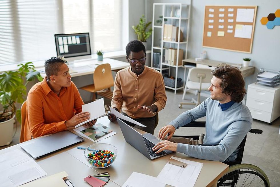 Team members set goals and create a business plan during a work meeting