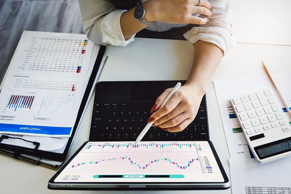 Woman creates a budget plan at work